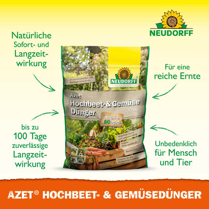A bag of Neudorff Shop Azet Raised Bed & Vegetable Fertilizer stands upright, with green text about the natural long-term effect, the safe application near humans and animals, and the improved yield. Images of vegetables and herbs adorn the background.