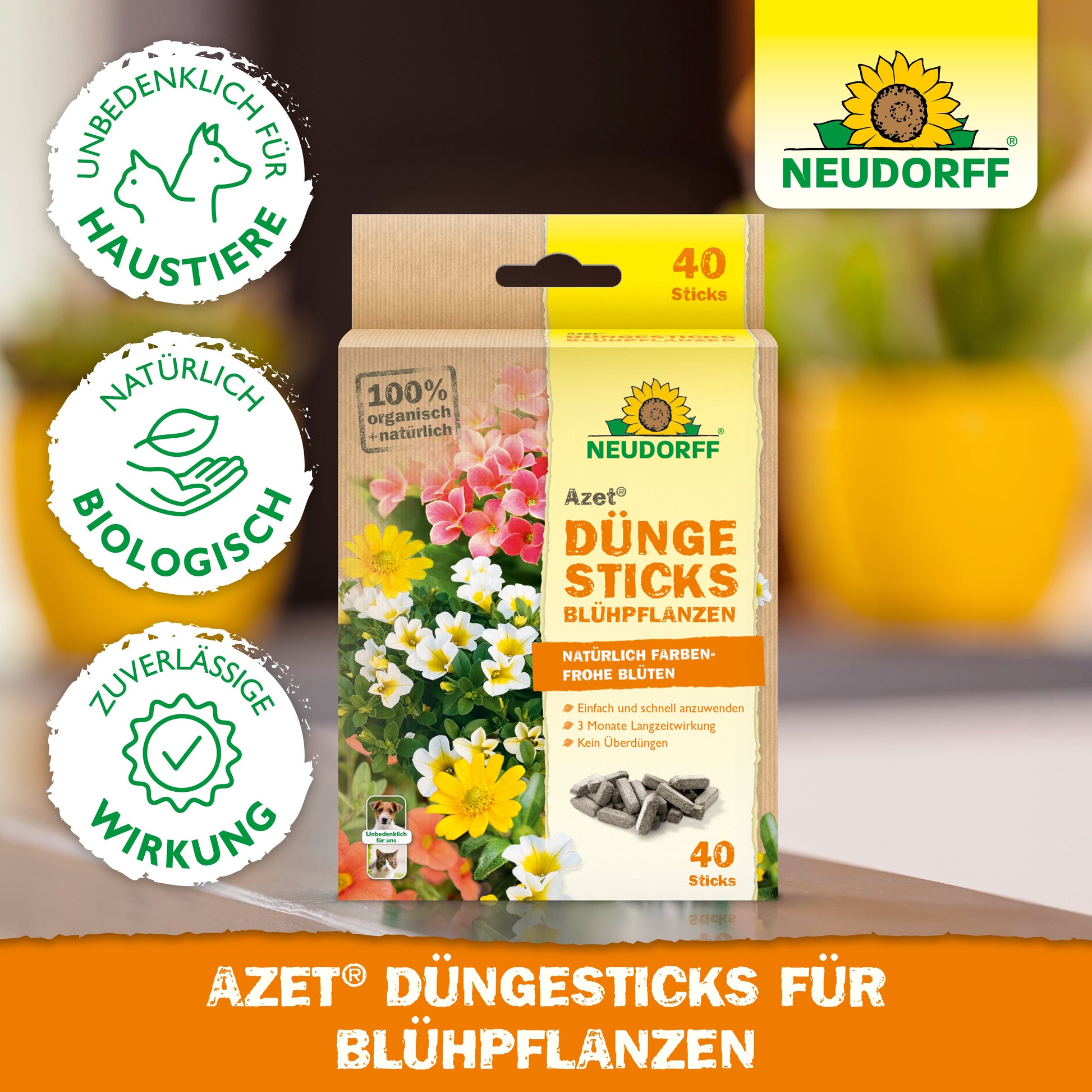 Eine Schachtel Azet Düngesticks für Blühpflanzen von Neudorff Shop (40 Sticks) wird vor blühenden Blumen gezeigt. Die Verpackung betont die Sicherheit für Haustiere, die natürlichen Inhaltsstoffe und die zuverlässige Wirksamkeit.