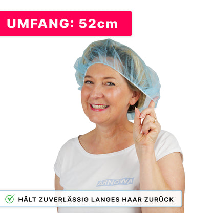 A smiling woman wears a blue ARNOMED COVER PP-BARETTHAUBE made of PP non-woven fabric by ARNOWA GmbH, touching the edge. At the top it says: "CIRCUMFERENCE: 52cm", below a label with a checkmark: "Reliably keeps long hair back in the hygiene sector."