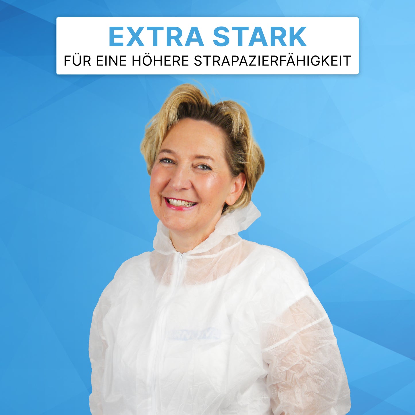 A smiling woman wears the white ARNOMED COVER PP-OVERALL XTRA STRONG from ARNOWA GmbH against a blue geometric background. Above her, a sign reads "EXTRA STRONG FOR HIGHER DURABILITY" in German.