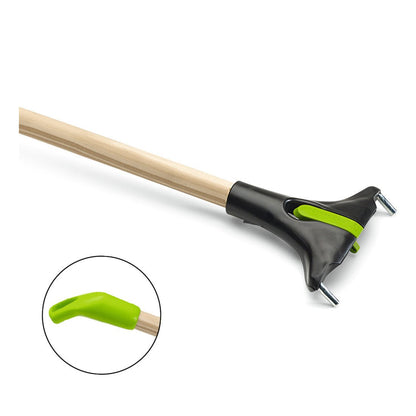 The Nölle Profi Brush BECOnnect wooden handle (Ø 23.5 mm) from Nölle Profi Brush Bürsten- & Pinseltechnik e.K. has a wooden handle, a black plastic head, two metal tines, the BECOnnect technology, and a green notched tip, as shown in the close-up.