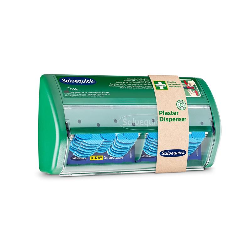 The Orkla Wound Care AB Salvequick X-ray detectable plaster dispenser shows visible blue, X-ray detectable plasters inside. It comes with 2x30 plaster refills and has a clear front with a labeled brown paper band.