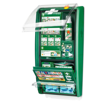 The Cederroth first aid & burn station from Orkla Wound Care AB is a green, wall-mounted set in a package with compartments for burns, gels, and bandages, as well as an illustrated guide in the lid and compartments.
