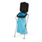 The Nölle Profi waste collector with metal legs (35x37x78 cm, black) from Nölle Profi Brush Bürsten- & Pinseltechnik e.K. securely holds a blue trash bag with an open lid, enabling easy and efficient waste management.