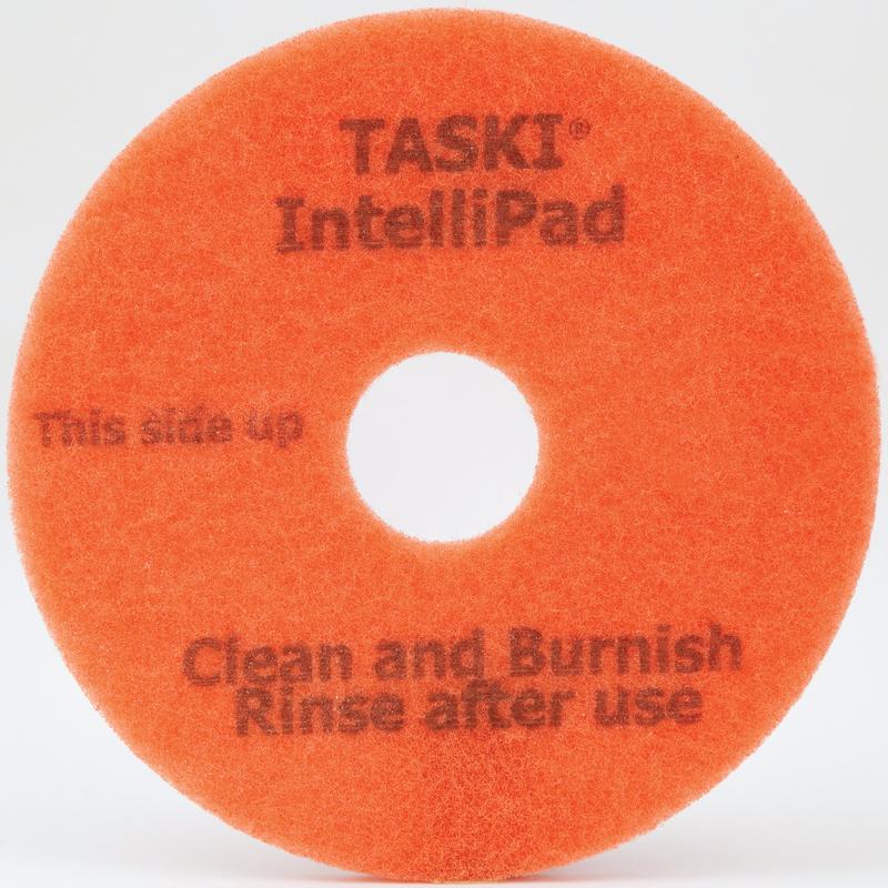 The TASKI Intellipad Combined Cleaning and Polishing Pad for maintenance cleaning from Diversey Deutschland GmbH & Co. OHG cleans and polishes floors effectively - with marking "This side up, Clean and Burnish, Rinse after use" and center hole.