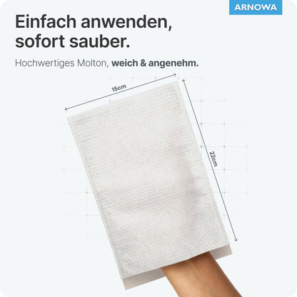 A hand is wearing a white ARNOMED disposable wash glove made of molton (15x22 cm) from ARNOWA GmbH, labeled as easy to handle, high-quality, and gentle for skincare. In the corner is the Dermatest seal and the ARNOWA logo.