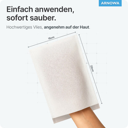 A hand is inside an ARNOMED disposable wash glove Spunlace with PE (22x15 cm). The product by ARNOWA GmbH is water-repellent, gentle on the skin, and easy to use. ARNowa logo at the top right of the image. Bag of 50 pieces.
