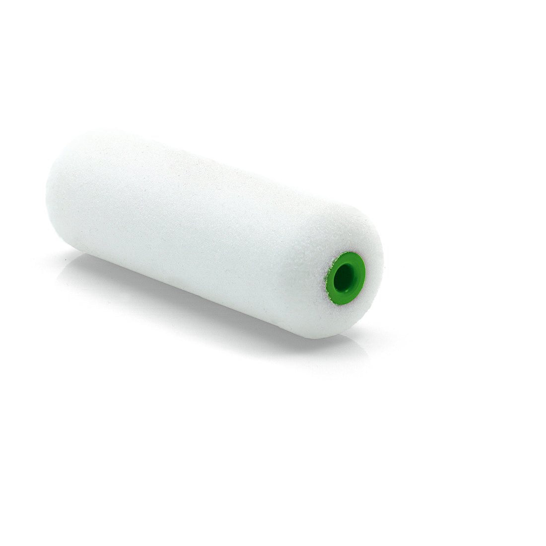 A Nölle Profi Brush paint roller superfine, 10 cm, round on both sides (white cylindrical paint roller with a green plastic core) from Nölle Profi Brush Bürsten- & Pinseltechnik e.K., lies on a white surface.