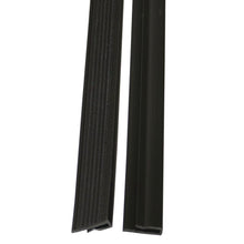 Two black TASKI VersaPlus 2.0 replacement hook-and-loop strips from Diversey Deutschland GmbH & Co. OHG are pictured side by side: the left strip is ribbed, the right one is smooth - each with a different cross-sectional profile.