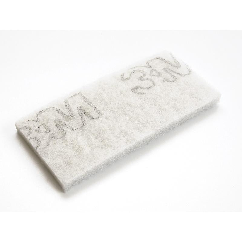 A white rectangular TASKI Jumbo pad for edge cleaning devices from Diversey Deutschland GmbH & Co. OHG, designed for professional cleaning, features several gray '3M' logos and is depicted on a plain white background.
