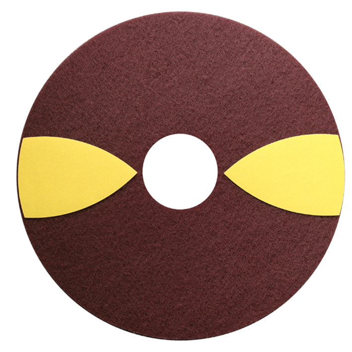 The TASKI JonWood Floor Pad 5pc W1 from Diversey Deutschland GmbH & Co. OHG is a round, brown pad with a hole in the middle and two yellow half-moons, designed for streak-free cleaning of wooden floors; depicted on a white background.