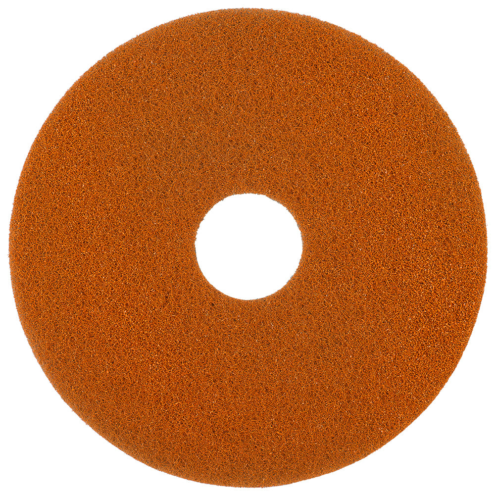 A round Twister Pad orange for stone floors by Diversey Deutschland GmbH & Co. OHG with a structured surface and central hole uses microscopic diamonds for cleaning; viewed from above on a white background.