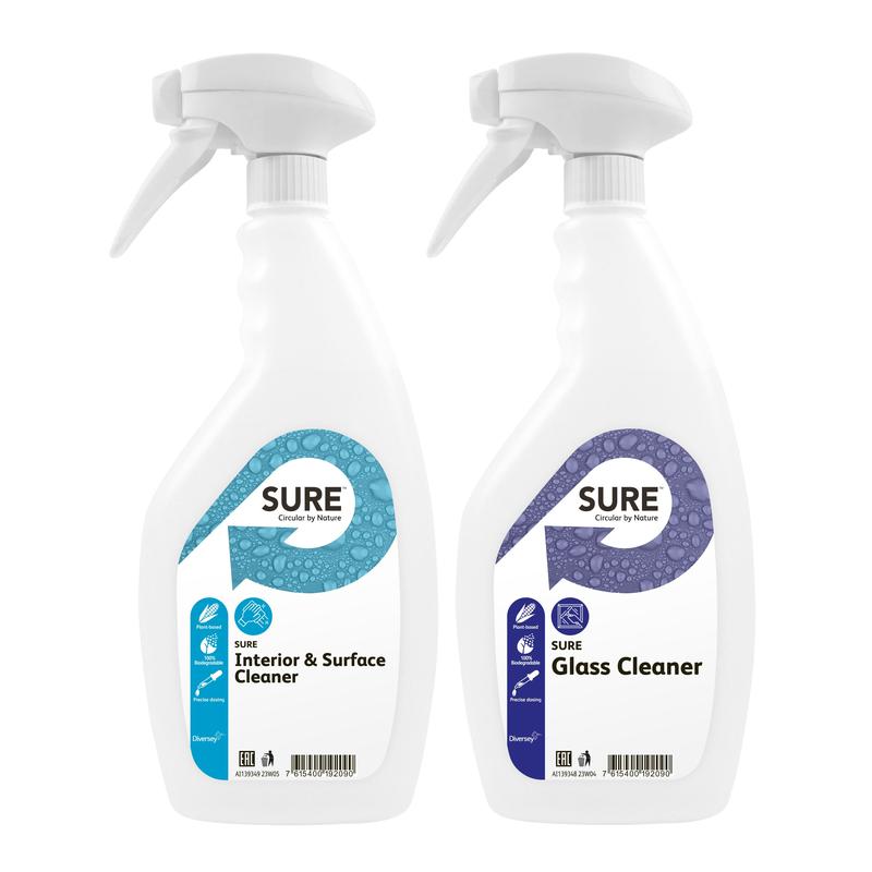 Two white trigger spray bottles from Diversey Deutschland GmbH & Co. OHG stand side by side, one labeled SURE Glass Cleaner and the other labeled SURE Interior & Surface Cleaner - eco-friendly cleaning solutions.