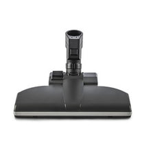 The TASKI Aero UP standard nozzle from Diversey Deutschland GmbH & Co. OHG is a black floor attachment with a rectangular base and central connection, perfect for commercial areas. Suitable for the TASKI Aero UP, package (1 piece), shown front view on a white background.