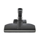The TASKI Aero UP standard nozzle from Diversey Deutschland GmbH & Co. OHG is a black floor attachment with a rectangular base and central connection, perfect for commercial areas. Suitable for the TASKI Aero UP, package (1 piece), shown front view on a white background.