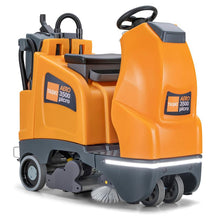 The TASKI AERO 3500µicro B BMS Li 150 from Diversey is a compact orange-gray ride-on vacuum based on the swingo 2100 with seat, steering wheel, lithium-ion batteries, integrated charger, and visible front brushes and wheels.