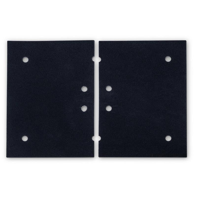 Two rectangular black TASKI Ultimaxx orbital pad holders (14x20 inches, 35x50cm) from Diversey Deutschland GmbH & Co. OHG lie side by side on a white background, each with evenly distributed circular holes - ideal for cleaning large areas with the TASKI Ultimaxx OB series.