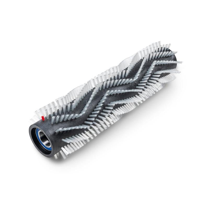 The TASKI Ultimaxx roller brush for exposed aggregate concrete (65cm) from Diversey Deutschland GmbH & Co. OHG is a replacement roller brush for the Ultimaxx RB series with angled, zigzag-shaped white bristles, a black core, and a red detail - ideal for cleaning exposed aggregate concrete.