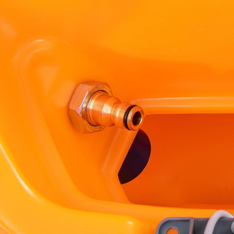 A close-up of a brass quick coupling with a hex nut on orange plastic, showing the Diversey TASKI Aqua fill stop automatic shut-off valve that prevents the fresh water tank from overflowing. A gray plastic part appears at the bottom right.