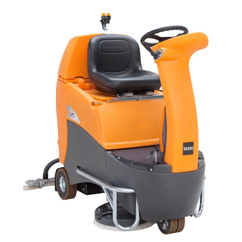 The TASKI swingo 2500 Li 200 Ah from Diversey is a compact, orange-gray ride-on scrubber dryer with lithium technology, seat, steering wheel, control panel, cleaning brushes at the bottom, and "TASKI" sticker on the front.