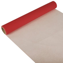 A partially unrolled PAPSTAR table runner, Tissue “ROYAL Collection” (3 m x 40 cm) from PAPSTAR GmbH is depicted diagonally on a white background, revealing the elegant red design and the simple white underside.