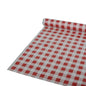 A roll of Starpak tablecloth foil, 50 m x 80 cm in red checkered pattern, is partially unrolled on a flat surface. The material is plastic foil.