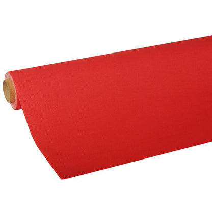 A partially unrolled PAPSTAR tablecloth from the ROYAL Collection of PAPSTAR GmbH shows a smooth, firm red tissue paper of high quality, neatly wrapped around a cardboard tube.