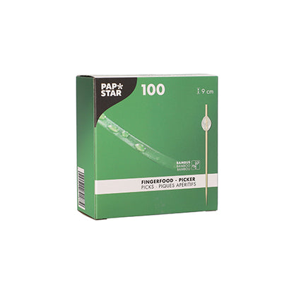 A green box from PAPSTAR GmbH labeled "PAPSTAR 100 Fingerfood - Picker" contains 100 bamboo picks each 9 cm long. The packaging shows an image of the food picker and product information in several languages.