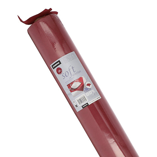A roll of red Starpak tablecloth, fabric-like fleece 'Soft Selection', is wrapped in transparent foil. The label shows a set table, product information, and a barcode. Brand: Starpak.
