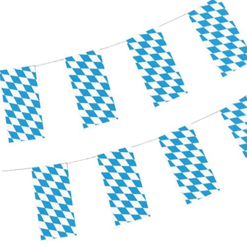 Two PAPSTAR paper flag chains (10m, flame retardant) in Bavarian blue hang diagonally. Each with the classic diamond pattern, perfect from PAPSTAR GmbH for Oktoberfest or festive occasions. Bag contains 1 piece.