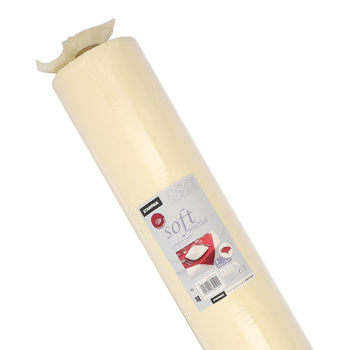 A large roll of light yellow baking paper “Soft Selection” by Starpak tablecloth, fabric-like fleece, with a label featuring the brand, product information, and images of baked goods for results as smooth as with the Soft Selection by Starpak.
