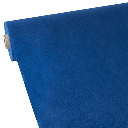 A partially unrolled blue Starpak tablecloth, fabric-like fleece “Soft Selection”, is seen from the top view at an angle against a white background.