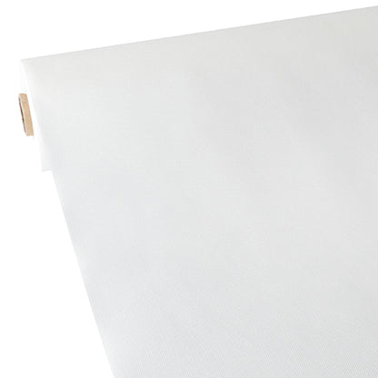 A roll of Starpak tablecloth, fabric-like, fleece “soft selection” in white is rolled out on a flat surface, showing the smooth, light fabric and the partially visible cardboard tube on the left.