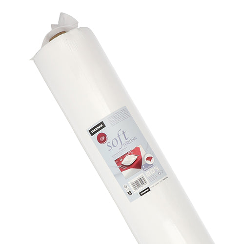 An upright, large white roll with the inscription “Soft Selection” shows the Starpak branding, product details, and a pillow image. This fabric-like fleece Starpak tablecloth is depicted against a white background.