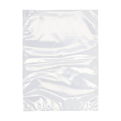 A Starpak 100 vacuum seal bag, PA / PE transparent, from Starpak lies flat on a white background. This smooth, slightly crumpled bag is ideal for chamber vacuum sealers to keep food fresh.