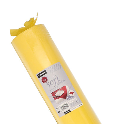 A roll of Starpak tablecloth, fabric-like fleece "Soft Selection", stands tilted against a white background and shows a label with the Starpak brand, the product name, and a table set with dishes.