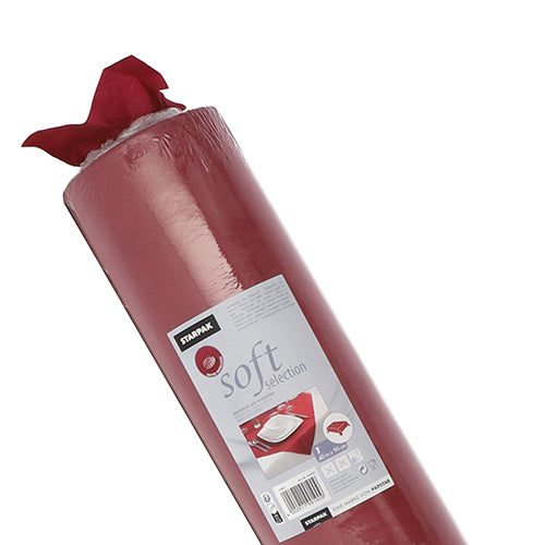 A partially unpacked roll of red Starpak tablecloth, fabric-like fleece "Soft Selection", with a label with usage instructions and images of a table decoration.