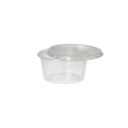 The Starpak 50 dressing cup, PP round Ø 7.1 cm transparent, is a transparent polypropylene cup with a snap lid - ideal for catering service. Presented on a plain white background.