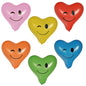 The six PAPSTAR balloons "Heart - Blinky" (Ø 28 cm, assorted colors) from PAPSTAR GmbH are arranged in two rows of three and each shows a winking smiley face in the colors pink, yellow, red, orange, green, and blue.