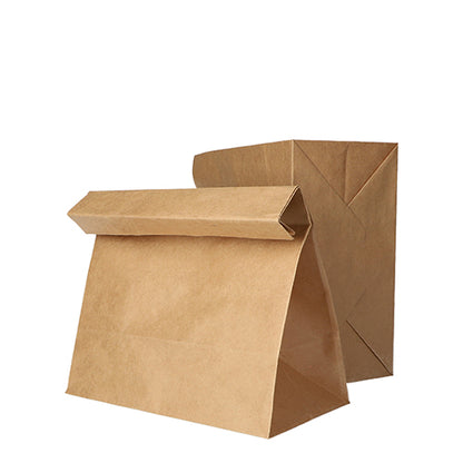 On a white background, two PAPSTAR 250 block bottom bags brown kraft paper from PAPSTAR GmbH are depicted, one standing and one with a folded-down top.