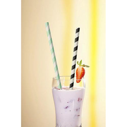 In a glass with pink milkshake, ice, fruit pieces, and a strawberry garnish, there are two PAPSTAR 100 paper straws Ø 6 mm (by PAPSTAR GmbH), one green striped and one black striped.