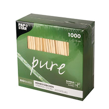 A green box with the inscription "PAPSTAR 1000 stir sticks, bamboo 'pure'" from PAPSTAR GmbH contains 1000 eco-friendly, biodegradable 15 cm long bamboo stir sticks and features a transparent window.