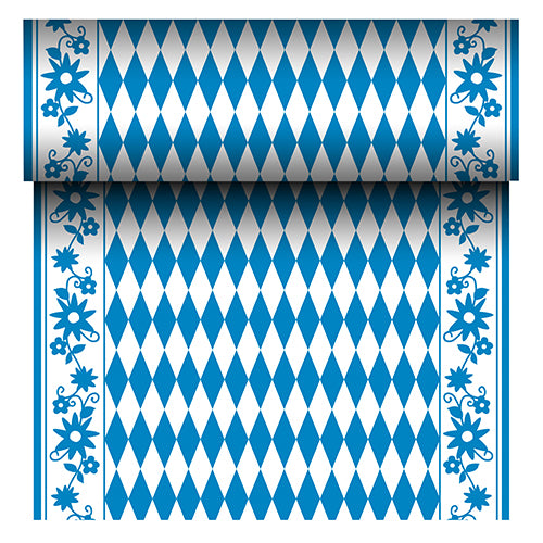 The PAPSTAR Airlaid table runner "Bayrisch Blau" (24 m x 40 cm) from PAPSTAR GmbH is a fabric-like table runner with a blue and white diamond center and a blue floral border. The roll reveals its repeating Bavarian pattern as it unrolls.