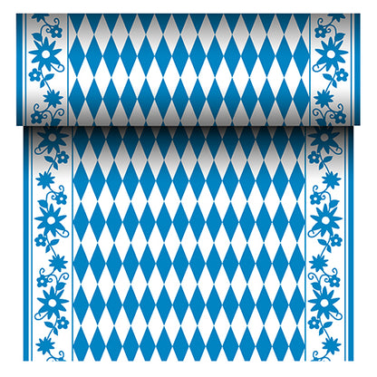 The PAPSTAR Airlaid table runner "Bayrisch Blau" (24 m x 40 cm) from PAPSTAR GmbH is a fabric-like table runner with a blue and white diamond center and a blue floral border. The roll reveals its repeating Bavarian pattern as it unrolls.