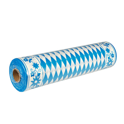 A partially unpacked PAPSTAR Airlaid table runner "Bayrisch Blau" (24 m x 40 cm), fabric-like, with blue and white diamond and floral edge design - ideal for a charming table decoration in Bavarian style. Brand: PAPSTAR GmbH.