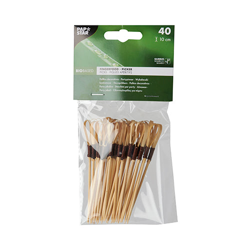 A transparent plastic packaging from PAPSTAR GmbH contains 40 finger food picks "Loop" made of bamboo, each 10 cm long - ideal for snacks and finger food. The eco-friendly picks are bundled with a dark band and have a green-and-white label with brand details.