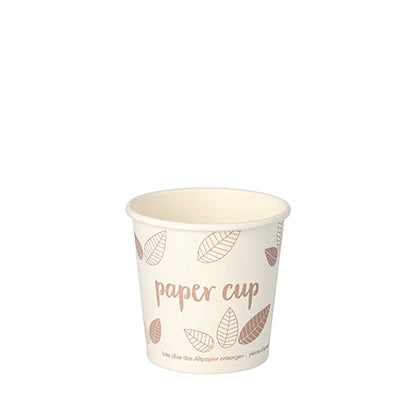 A beige PAPSTAR GmbH 80 drinking cup, cardboard "pure" cardboard cup with brown leaf motifs and "cardboard cup" text. This environmentally friendly disposable drinking cup is presented against a plain white background.