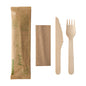 The PAPSTAR cutlery set wood "pure" by PAPSTAR GmbH contains a knife, fork, and napkin made of wood in a paper bag - ideal for sustainable events.