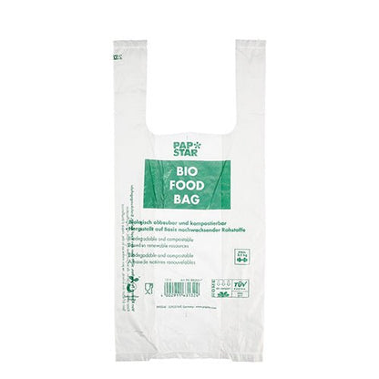 A transparent bio-film bag with the inscription "BIO FOOD BAG" with green text from PAPSTAR GmbH. This environmentally friendly shirt carrier bag is biodegradable, compostable, and comes as a roll of 100 knot bags.