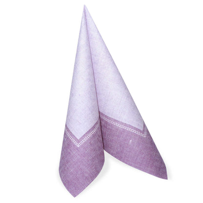 A folded fuchsia PAPSTAR napkin 40 x 40 cm "ROYAL Collection" from PAPSTAR GmbH with the 1/4 fold stands upright from the 50-pack of napkins.